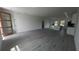 Open-concept living space with modern finishes, including stylish lighting and luxury vinyl plank flooring at 16367 Sw 17Th Terrace Rd, Ocala, FL 34473