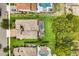 Aerial view of a luxury home with a pool, spa, and lush backyard, showcasing the home's private oasis at 16761 Broadwater Ave, Winter Garden, FL 34787