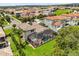 Aerial view of a two-story home with a screened-in pool, lush backyard, and beautifully landscaped surroundings at 16761 Broadwater Ave, Winter Garden, FL 34787