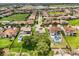 Aerial view of a neighborhood with lush green lawns, mature trees, and a variety of home styles at 16761 Broadwater Ave, Winter Garden, FL 34787