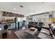 Home wet bar features an array of drinks, quirky decor, and comfortable seating at 16761 Broadwater Ave, Winter Garden, FL 34787