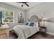 Cozy bedroom featuring a comfortable bed, stylish decor, and a bright window with natural light at 16761 Broadwater Ave, Winter Garden, FL 34787