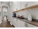 Stylish butler's pantry featuring white cabinetry, modern countertops, and ample storage, conveniently located near the kitchen at 16761 Broadwater Ave, Winter Garden, FL 34787