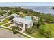 Aerial view of a clubhouse with a pool and gym, nestled in a lush landscape with lake views at 16761 Broadwater Ave, Winter Garden, FL 34787