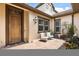 Front courtyard with a quaint seating area and a landscaped entrance at 16761 Broadwater Ave, Winter Garden, FL 34787