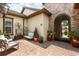 Front courtyard with comfortable seating and attractive landscaping at 16761 Broadwater Ave, Winter Garden, FL 34787