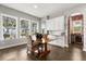 Bright dining area featuring large windows and stylish decor, creating an inviting space for meals at 16761 Broadwater Ave, Winter Garden, FL 34787