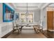 Bright dining room featuring stylish decor, hardwood floors and ample natural light at 16761 Broadwater Ave, Winter Garden, FL 34787