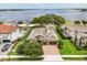 Beautifully landscaped two-story home with a tile roof, three-car garage, and breathtaking lake views at 16761 Broadwater Ave, Winter Garden, FL 34787