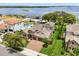 Stunning two-story home with a beautiful tile roof, well-manicured lawn, and a private dock on the lake at 16761 Broadwater Ave, Winter Garden, FL 34787