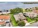 Beautifully landscaped two-story home with a tile roof, three-car garage, and stunning views of the lake at 16761 Broadwater Ave, Winter Garden, FL 34787