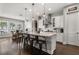 Gourmet kitchen featuring a large island, stainless appliances, granite counters, and a bright, open design at 16761 Broadwater Ave, Winter Garden, FL 34787