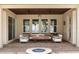 Outdoor patio with ceiling fans, comfortable seating, and a fire pit at 16761 Broadwater Ave, Winter Garden, FL 34787