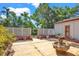 Backyard featuring a stone fountain surrounded by a white lattice fence and various plants at 1705 Virginia Dr, Orlando, FL 32803
