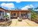 Backyard with a covered patio, outdoor furniture, a stone fountain, and grill at 1705 Virginia Dr, Orlando, FL 32803