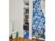Closet featuring organizers, storage shelving, and blue and white shower curtains at 1705 Virginia Dr, Orlando, FL 32803