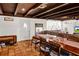 Dining room with decorative wood beamed ceilings, ceramic tile flooring, and dining table at 1705 Virginia Dr, Orlando, FL 32803