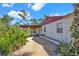 Well-maintained home exterior on a large lot with mature landscaping and a covered parking area at 1705 Virginia Dr, Orlando, FL 32803