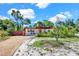 Charming single-story home with a gravel drive and mature landscaping creating nice curb appeal at 1705 Virginia Dr, Orlando, FL 32803