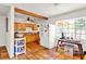 Kitchen with bright wood cabinets, white appliances, and a large window at 1705 Virginia Dr, Orlando, FL 32803