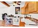 Kitchen featuring wooden cabinets, ceramic tile countertops, and a ceiling fan at 1705 Virginia Dr, Orlando, FL 32803