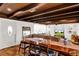 Bright and spacious living room with a wooden dining table and ample natural light at 1705 Virginia Dr, Orlando, FL 32803