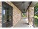 Long brick balcony with ceiling fans and black metal railing at 17524 Seidner Rd, Winter Garden, FL 34787