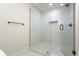Modern bathroom shower with glass door, white tile, and bronze fixtures at 17524 Seidner Rd, Winter Garden, FL 34787