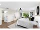 Sun-filled bedroom with hardwood floors, ensuite bathroom, and modern lighting at 17524 Seidner Rd, Winter Garden, FL 34787