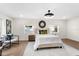 Well-lit bedroom with hardwood floors, stylish decor, large windows, and a neutral color palette at 17524 Seidner Rd, Winter Garden, FL 34787