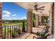 Relaxing outdoor living space with brick pillars, ceiling fans, and views of the beautifully landscaped surroundings at 17524 Seidner Rd, Winter Garden, FL 34787