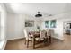 Bright dining room featuring a wood table, upholstered chairs, and stylish artwork at 17524 Seidner Rd, Winter Garden, FL 34787