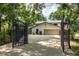 Gated driveway leading to a spacious two-car garage of a well-maintained home with a neutral color palette at 17524 Seidner Rd, Winter Garden, FL 34787
