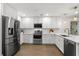 Well-lit kitchen with white cabinets, stainless steel appliances, and stylish countertops at 17524 Seidner Rd, Winter Garden, FL 34787
