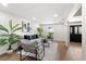 Bright and airy living room featuring hardwood floors, neutral decor, and modern furniture, perfect for relaxation at 17524 Seidner Rd, Winter Garden, FL 34787