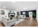 Inviting living room featuring a fireplace, hardwood floors, neutral paint scheme, and plenty of natural light at 17524 Seidner Rd, Winter Garden, FL 34787