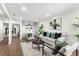 Comfortable living room featuring hardwood floors, stylish decor, and an open layout, ideal for entertaining guests at 17524 Seidner Rd, Winter Garden, FL 34787