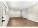 Bright living room with wood floors and a double-door closet at 17524 Seidner Rd, Winter Garden, FL 34787