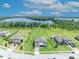 Aerial view showcases homes, waterfront views, and expansive green space at 17537 Sailfin Dr, Orlando, FL 32820