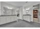 Spacious bathroom featuring double vanities with gray granite countertops and tile floors at 17537 Sailfin Dr, Orlando, FL 32820