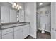 Bathroom featuring granite counters, white cabinets, and a separate toilet and shower area at 17537 Sailfin Dr, Orlando, FL 32820