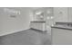 Bathroom featuring double sinks with gray granite countertops and neutral colored cabinets at 17537 Sailfin Dr, Orlando, FL 32820