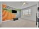 Stylish bedroom featuring colorful wall design and bunk beds near a bright, windowed wall at 17537 Sailfin Dr, Orlando, FL 32820