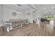 Bright and airy dining area with modern lighting, wood floors, and open access to the expansive living space at 17537 Sailfin Dr, Orlando, FL 32820