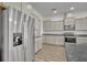 The kitchen boasts stainless appliances, granite counters and ample cabinet space at 17537 Sailfin Dr, Orlando, FL 32820
