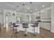 A kitchen boasts an island with granite countertops, pendant lighting, and seating at 17537 Sailfin Dr, Orlando, FL 32820