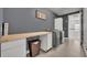 Functional laundry room with modern washer, dryer, and wood folding table at 17537 Sailfin Dr, Orlando, FL 32820