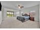 Large main bedroom with access to a covered balcony at 17537 Sailfin Dr, Orlando, FL 32820