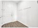 Clean mud room features hooks, white trim and neutral paint at 17537 Sailfin Dr, Orlando, FL 32820