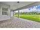 Spacious outdoor patio offers serene views of the green backyard at 17537 Sailfin Dr, Orlando, FL 32820